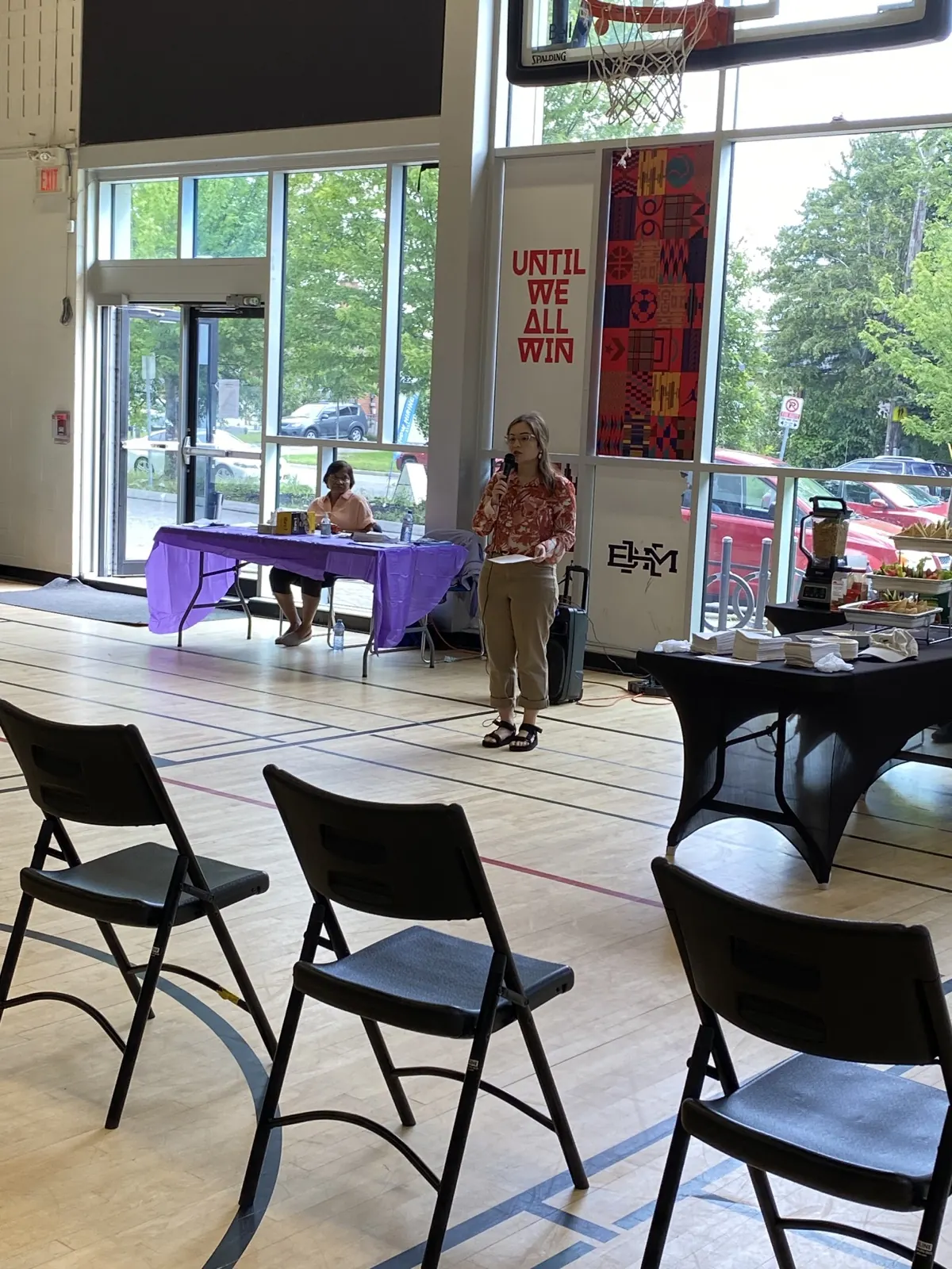 Chairs and a teaching table set up for a community oral-health session